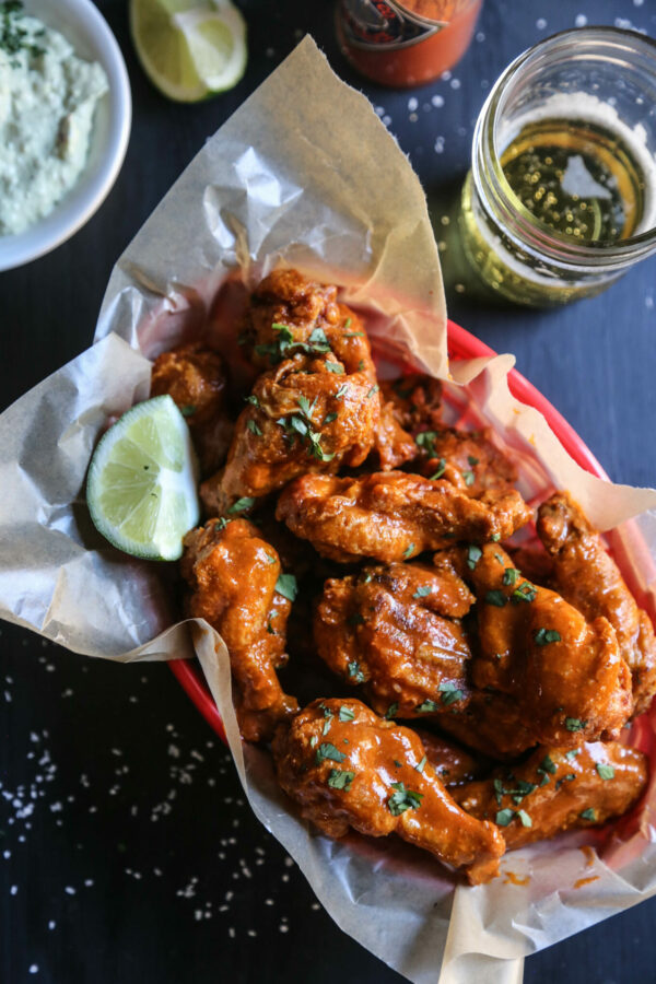 mexican spiced crispy-oven wings with avocado crema